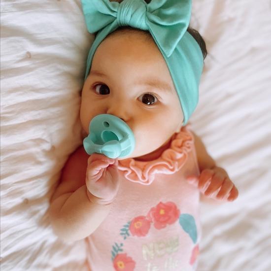 Sweetie Soother Pacifier Set (2 Pack)- Aquamarine & Peach Bows by Itzy Ritzy